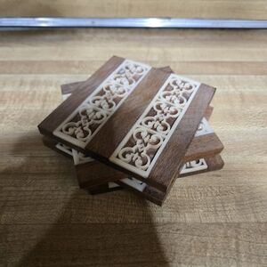 4pc Coaster set boho rustic vibesWood grain with ivory plastic ribbon design.